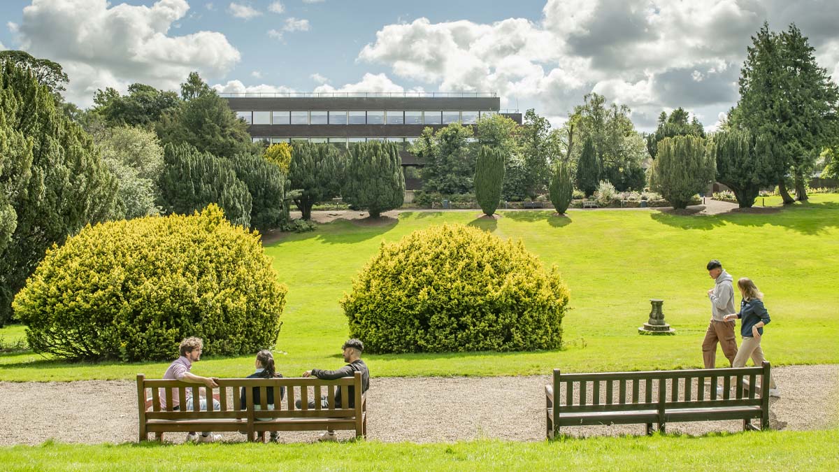 students walking past the lawn